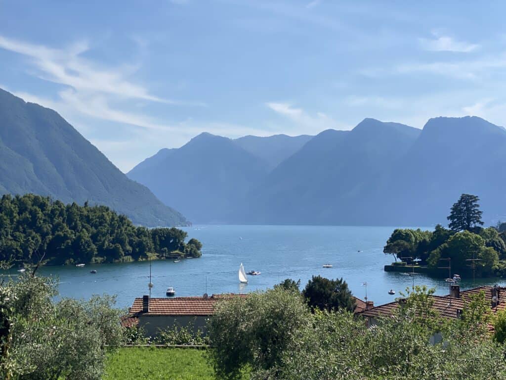 Lake Como view, sailing boat, island, olive trees